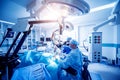 A team of surgeons performing brain surgery to remove a tumor.