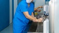 A team of surgeons wash their hands before surgery. Royalty Free Stock Photo