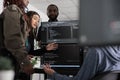 Team of system engineer writing data and discussing about coding language Royalty Free Stock Photo