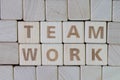 Team, teamwork the effort to work togetther to complete the goals concept by cube wooden block with alphabet building the word