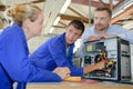 team technicians examining computer