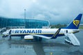 A team of technicians prepares the plane for departure