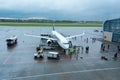 A team of technicians prepares the plane for departure Royalty Free Stock Photo