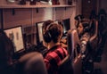 Team of teenage gamers plays in a multiplayer video game on pc in a gaming club. Royalty Free Stock Photo