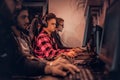 Team of teenage gamers plays in a multiplayer video game on pc in a gaming club. Royalty Free Stock Photo