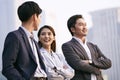 Asian business people talking outdoors Royalty Free Stock Photo