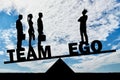 Team of three employees weighs more than one with their big ego Royalty Free Stock Photo