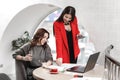 Team of two interior designers stylish young women are working in the office at the design project Royalty Free Stock Photo