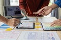 A team of UI UX web designers is working together to develop a mobile responsive website by previewing UI UX Front Royalty Free Stock Photo