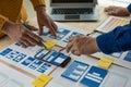 A team of UI UX web designers is working together to develop a mobile responsive website by previewing UI UX Front Royalty Free Stock Photo