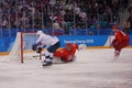 Team United States in white in action against Team Olympic Athlete from Russia Men`s ice hockey preliminary round game Royalty Free Stock Photo