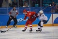 Team United States in white in action against Team Olympic Athlete from Russia Men`s ice hockey preliminary round game Royalty Free Stock Photo