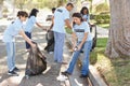 Team Of Volunteers Picking Up Litter In Suburban Street Royalty Free Stock Photo