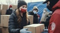 Team of volunteers working in charity donation center to the victims.