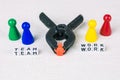 Team work concept - Figures form with clamp tool as symbol for a working labor team collaboration Royalty Free Stock Photo