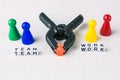 Team work concept - Figures form with clamp tool as symbol for a working labor team collaboration Royalty Free Stock Photo