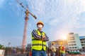 Team work of Construction engineers technician and  architect supervising progress stand in control of building foundations Royalty Free Stock Photo