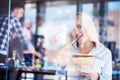 Team work discussing. Open space office and startup crew brainstorming at new project. Young women with paper folder. Royalty Free Stock Photo