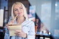 Team work discussing. Open space office and startup crew brainstorming at new project. Young women with paper folder. Royalty Free Stock Photo