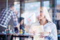 Team work discussing. Open space office and startup crew brainstorming at new project. Young women with paper folder. Royalty Free Stock Photo