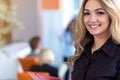 Team work discussing. Young woman with paper folder. Royalty Free Stock Photo