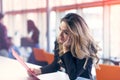 Team work discussing. Young woman with paper folder. Royalty Free Stock Photo