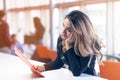 Team work discussing. Young woman with paper folder. Royalty Free Stock Photo