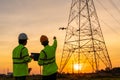 Team work of Engineers location help Technician use drone to fly inspections at the electric power station to view the planning