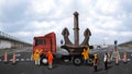 Team at work for an exceptional transport of a big anchor Royalty Free Stock Photo