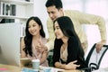 Team work group colleagues young business people in smart casual discuss project look at computer screen in meeting room office, i Royalty Free Stock Photo