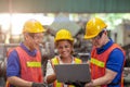 Team work mix race and gender african american and asian worker happy working together in industry factory Royalty Free Stock Photo