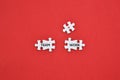 `Team, work and plus symbol` word on white puzzles with red background flat lay concept.
