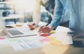 Team work process.Photo young business managers crew working with new startup project.Notebook on wood table, typing Royalty Free Stock Photo