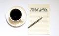 TEAM WORK - white paper with pen and coffee on white background Royalty Free Stock Photo