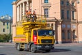 A team of workers on the car of the city electric transport emergency service