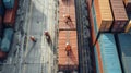 A team of workers is carefully loading and securing containers onto a flatbed truck ensuring maximum efficiency and Royalty Free Stock Photo