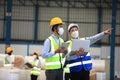 Team workers wear protective face masks for safety industrial factory.