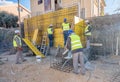 Team of workers working on a new building construction site Royalty Free Stock Photo