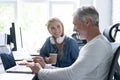 Team Working At Desks In Busy Office. Royalty Free Stock Photo