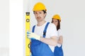 Team of workmen align wall Royalty Free Stock Photo