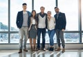 The team youll want to be part of. Portrait of a group of confident young businesspeople standing together in the office Royalty Free Stock Photo