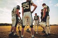 American football players standing in a circle during practice Royalty Free Stock Photo
