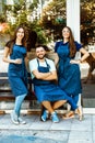 A team of young barists near a cafe