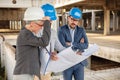 Team of young business people having a meeting on a construction site Royalty Free Stock Photo