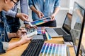 Team of young colleagues creative graphic designer working on color selection and drawing on graphics tablet at workplace, Color Royalty Free Stock Photo