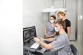 A team of young dentists works in a well-equipped office