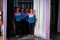 Team of young girls - athletes are preparing for the show, many young cheerleaders are standing on stage behind the curtain, sport Royalty Free Stock Photo