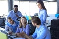 Team young professionals having casual discussion in office. Executives having friendly discussion during break. Royalty Free Stock Photo