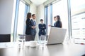 Team young professionals having casual discussion in office. Executives having friendly discussion during break. Royalty Free Stock Photo