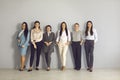 Team of young smiling businesswomen corporate partners standing together and looking at camera Royalty Free Stock Photo